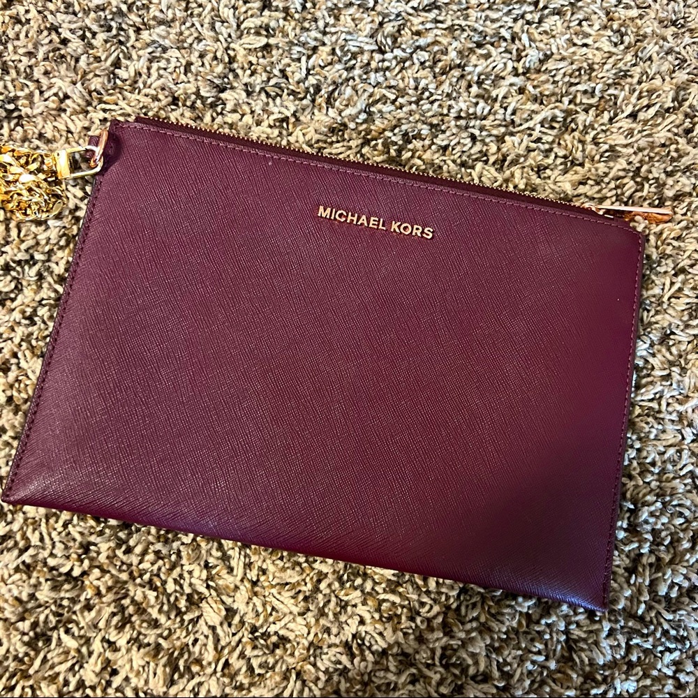 Michael Kors clutch -removable gold chain /wallet inside . Burgundy dark color
